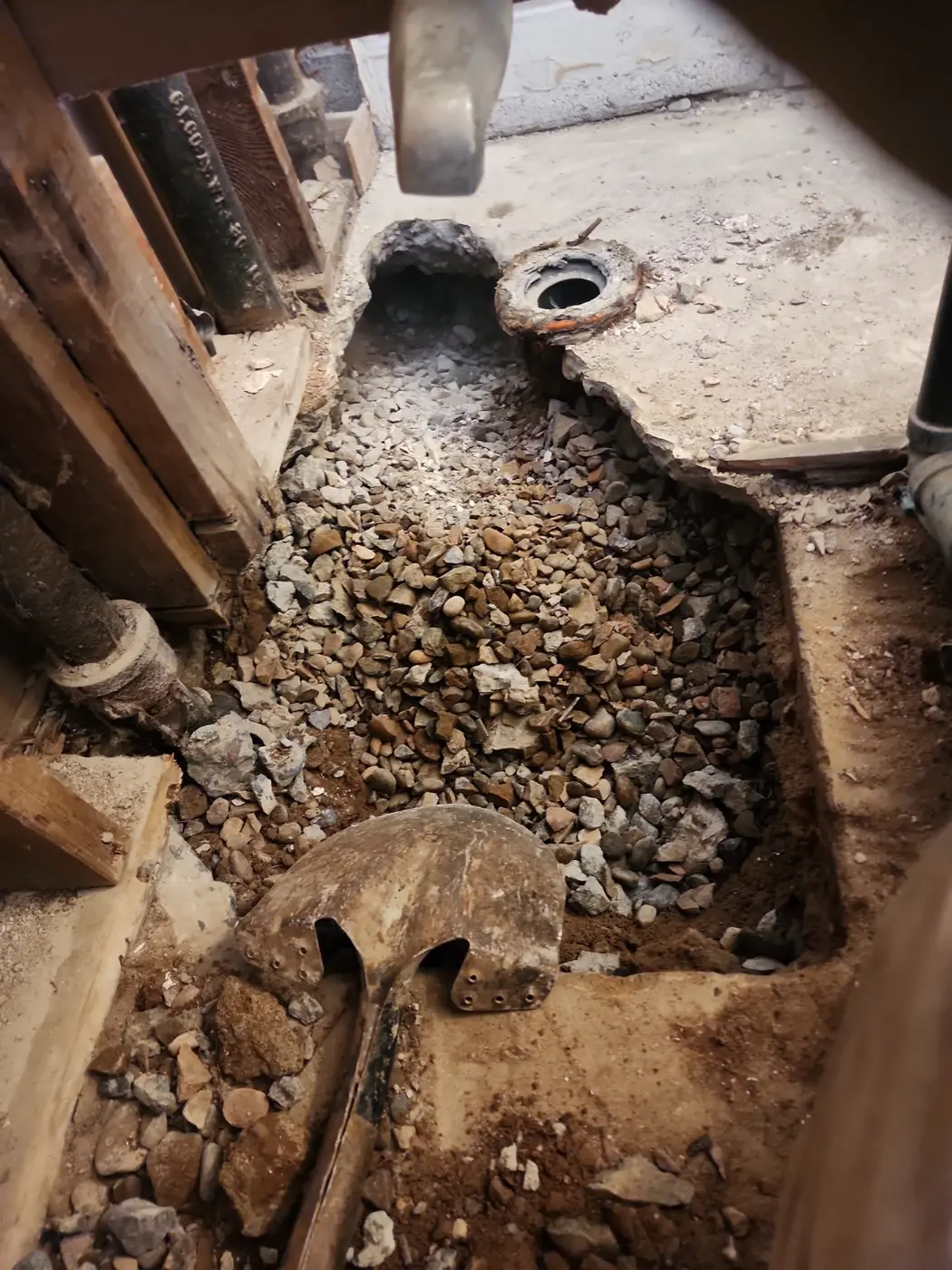 Interior concrete slab opened during renovation preparation
